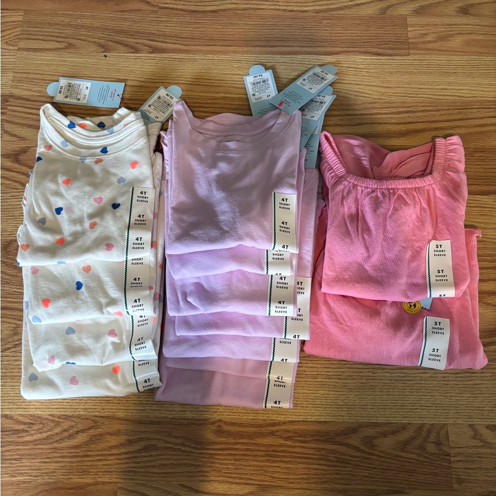 13 brand new Kids shirts with tags. Tags say $4-$7.